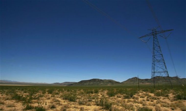 An electric tower and power lines cross the proposed site of a BrightSource Energy solar plant on federal land near Primm, Nev. The presence of existing towers make the area a prime site for solar development.